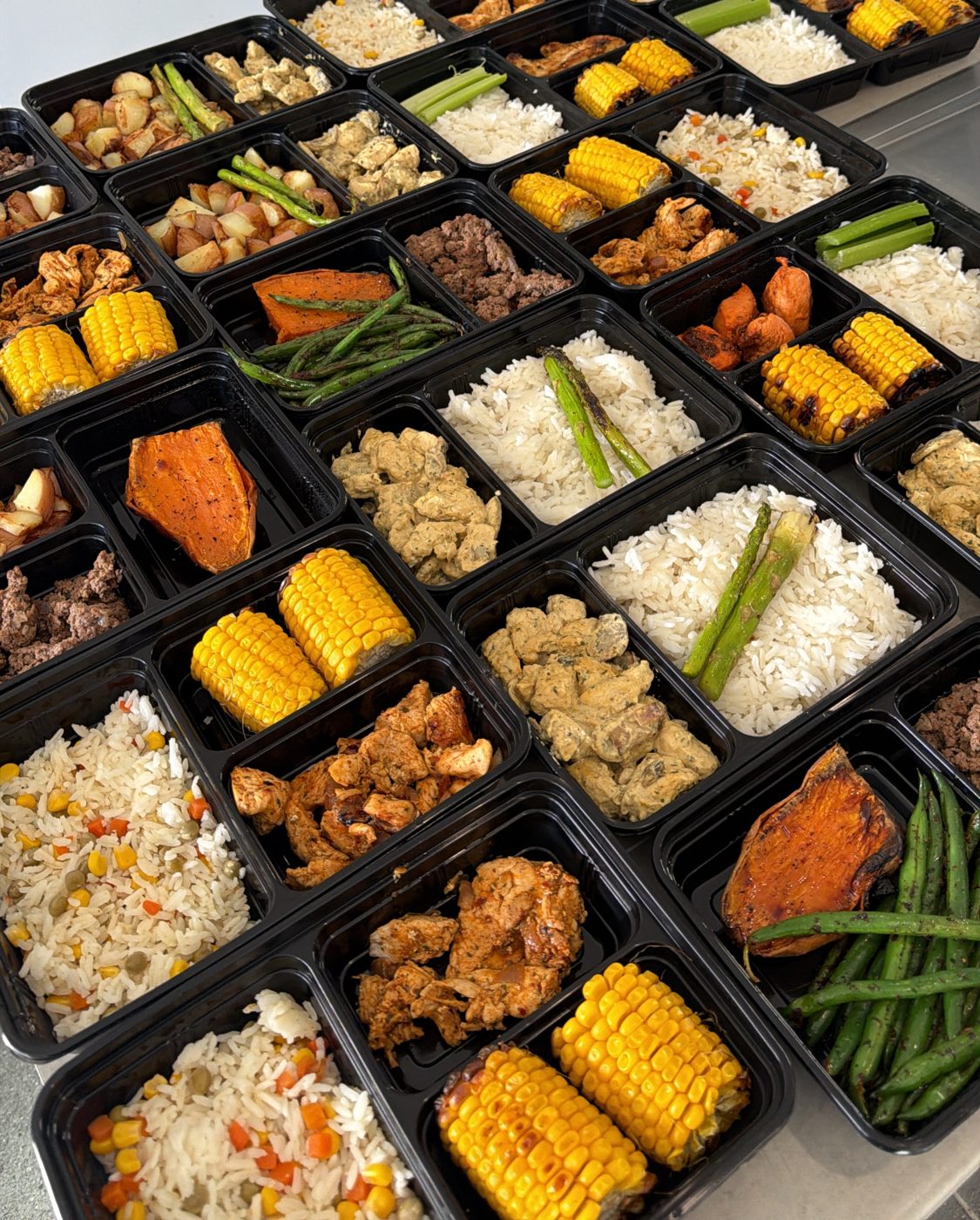 Around thirty Ki Prep meal boxes lined up on the kitchen bench on prep day